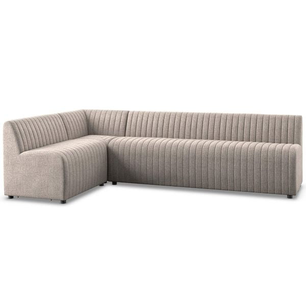 Sofa narozna o zaokraglonej formie z naturalnym charakterem w odcieniu szarosci